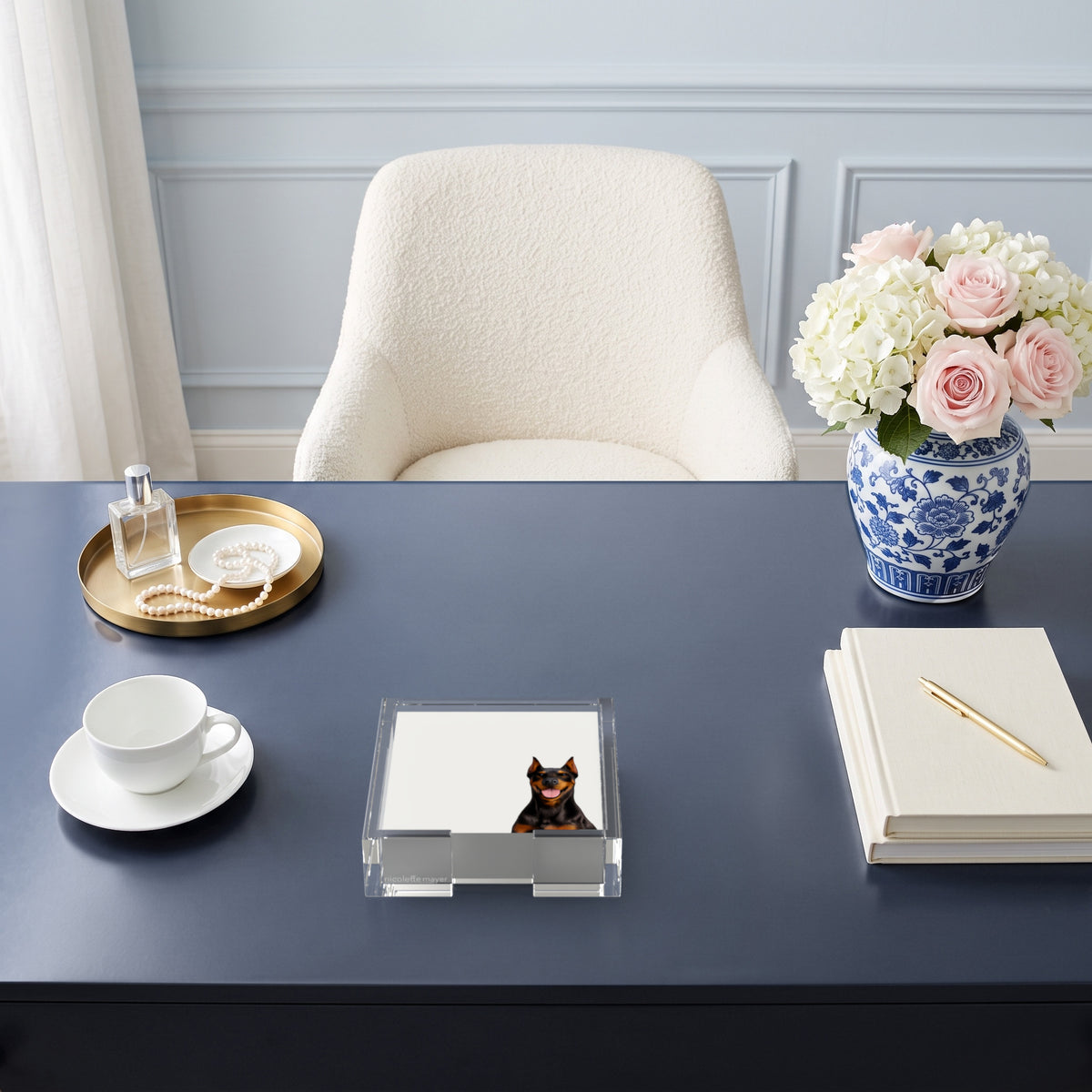 Doberman dog note cards in a clear acrylic holder on a navy desk, by Nicolette Mayer
