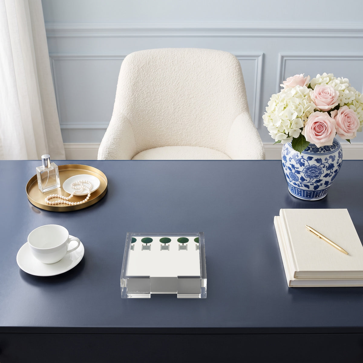 Topiary note cards in a clear acrylic holder on a navy desk by Nicolette Mayer