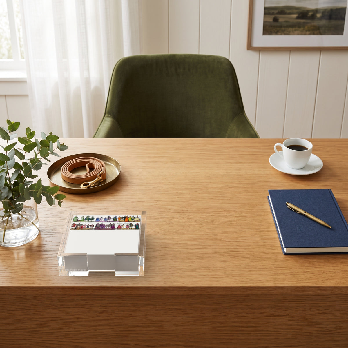 Costumes 1830 notepad in a clear acrylic holder on an oak desk by Nicolette Mayer